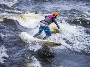 A group of outdoor enthusiasts, including Trevor Cunningham, president of River-Surf Ottawa Gatineau, were out enjoying the mild temperatures for surfing on the Ottawa River near Parc Brébeuf in Gatineau on Saturday.