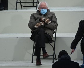 In this file photo taken on January 20, 2021 Former presidential candidate, Senator Bernie Sanders (D-Vermont) sits in the bleachers on Capitol Hill before Joe Biden is sworn in as the 46th US President at the US Capitol in Washington, DC.