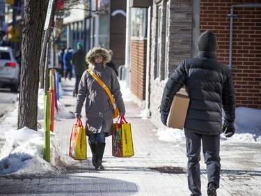 The bright sun helped to get people out and about on the chilly day Ottawa had Sunday Jan. 30, 2021. Shoppers and walkers made their way down Richmond Road Saturday morning.