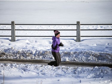 The bright sun helped to get people out and about on the chilly day Ottawa had Sunday Jan. 30, 2021.  A runner was dressed properly to stay warm while out for a run along the Canal Saturday.