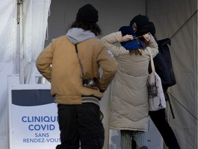 A steady trickle of people arrive at the Hotel Dieu Covid-19 testing site in Montreal, on Tuesday, December 29, 2020.