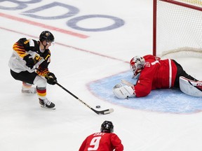 Goaltender Devon Levi of Canada defends the net against Tim Stuetzle of Germany during the 2021 IIHF World Junior Championship at Rogers Place on December 26, 2020 in Edmonton, Canada.