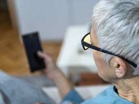 Woman holding a smart phone.