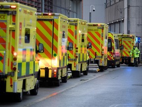 A row of ambulances is seen outside the Royal London Hospital, on January 05, 2021 in London, England.