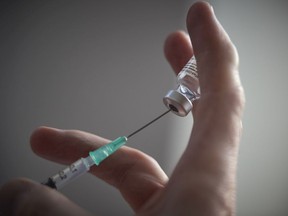 FILE: A nurse prepares Pfizer BioNTech Covid-19 vaccines.
