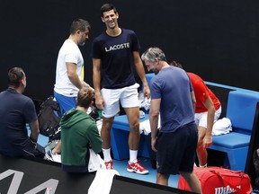 Novak Djokovic of Serbia is seen leaving a practice session at Melbourne Park on January 30, 2021 in Melbourne, Australia. Melbourne Park is now out of lockdown mode following the end of the player and support staff quarantine period after arriving in Melbourne on International flights and they can resume a regular practice schedule ahead of lead in tournaments before the 2021 Australian Open.