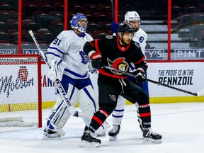 Ottawa Senators center Artem Anisimov battles with Toronto Maple Leafs defenceman Jake Muzzin in front of Leafs goaltender Frederik Andersen on Friday at the Canadian Tire Centre.