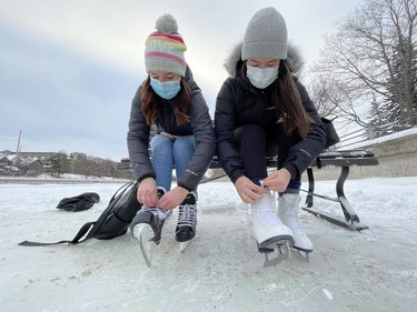 OTTAWA -- Lauren Flynn (L) and Jessie Prevec were amongst the first skaters on the Rideau Canal Skateway when it opened at 8:00 a.m. on Thursday, Jan. 28, 2021.