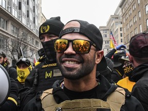 Enrique Tarrio, leader of the Proud Boys, stands outside Harry's bar during a protest on December 12, 2020 in Washington, DC.