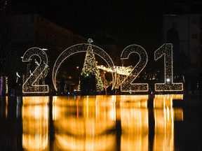 A 2021 sign is displayed in downtown Pristina, Kosovo on December 30, 2020.
