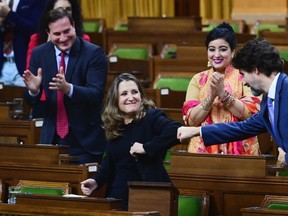 Minister of Finance Chrystia Freeland gets a fist bump from Prime Minister Justin Trudeau after delivering the 2020 fiscal update in the House of Commons on Parliament Hill in Ottawa on Monday, Nov. 30, 2020.