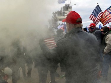 Trump supporters clash with police and security forces as people try to storm the US Capitol Building in Washington, DC, on January 6, 2021. - Demonstrators breeched security and entered the Capitol as Congress debated the a 2020 presidential election Electoral Vote Certification. (Photo by Joseph Prezioso / AFP)