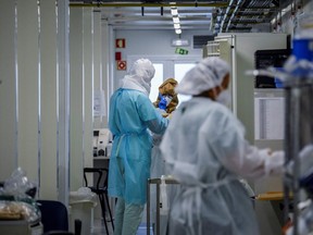 Healthcare workers chat at the COVID-19 emergency room of Santa Maria hospital in Lisbon on January 11, 2021. Portugal has suffered record numbers of coronavirus deaths and hospitalisations over the last 24 hours, making a new lockdown unavoidable.