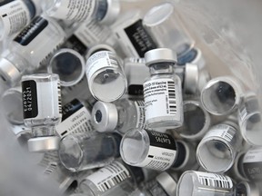 (FILES) This file photo taken on January 08, 2021 shows empty bottles of Pfizer-BioNTech Covid-19 vaccine.