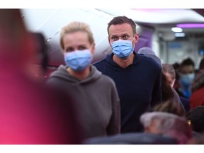 Russian opposition leader Alexei Navalny and his wife Yulia are seen in a Pobeda plane heading from Berlin to Moscow on Jan. 17, 2021. Navalny was arrested as soon as he landed.