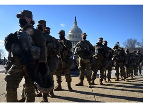 Members of the National Guard gather at a security checkpoint near the U.S. Capitol, ahead of the inaugural ceremony for President Joe Biden and Vice-President Kamala Harris in Washington, D.C.
