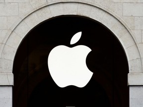 FILE PHOTO: Apple logo is seen on the Apple store at The Marche Saint Germain in Paris, France July 15, 2020.