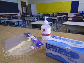 A file photo of personal protection equipment on a teacher's desk.