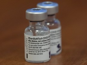 A file photo shows two empty vials of the Pfizer-BioNTech COVID-19 vaccine at The Ottawa Hospital.