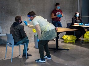 A swab is taken at a pop-up COVID-19 testing site on the Dalhousie University campus in Halifax on Wednesday, Nov. 25, 2020.