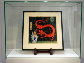 Painting for the original cover of "The Blue Lotus" (Lotus Bleu) Tintin comic book (1936), is displayed before being auctioned by Artcurial in Paris, France January 13, 2021.
