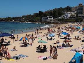 Beachgoers enjoy a summer day at Coogee Beach following an outbreak of the coronavirus disease (COVID-19) in Sydney, Australia, January 13, 2021.
