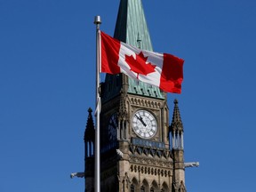 FILE PHOTO: A Canadian flag flies in front of the Peace Tower on Parliament Hill in Ottawa.