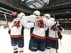 Washington Capitals' Alex Ovechkin (8) celebrates with teammates after a goal.