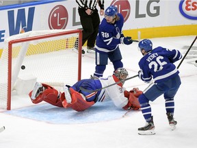 Leafs' Jimmy Vesey scores the tying goal in the third period against Canadiens goalie Carey Price Wednesday night in Toronto.