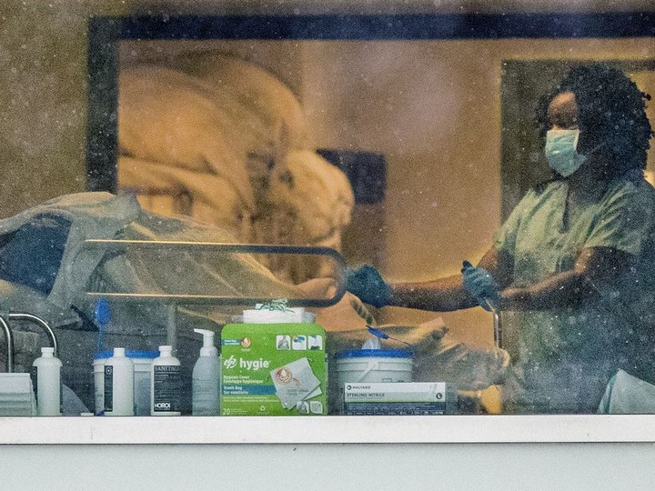  FILE: A hospital worker pushes a bed at Hôpital Pierre-Boucher in Longueuil, south of Montreal Wednesday December 9, 2020.