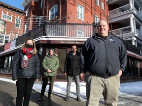 The Whalesbone restaurant group Peter McCallum (right), Jean Watson, Michael Radford and Craig Sasso in front of the old Fox and Feather pub on Elgin in Ottawa Wednesday Jan 20, 2021. The group is turning the old pub into a high-end steakhouse, which they hope will open July 1.