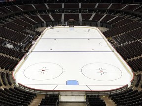 Files: Building operations workers preparing the ice at the Canadian Tire Centre.