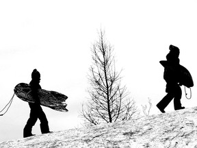 A file photo of people sledding in Ottawa.