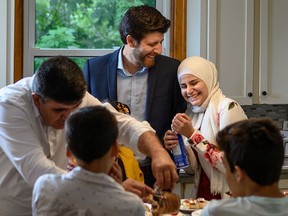 Tareq Hadhad and his family gather in their kitchen in Antigonish, N.S.
