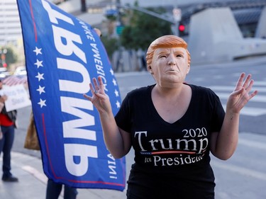 A supporter wears a mask of U.S. President Donald Trump during a protest in Los Angeles, California, U.S., January 6, 2021. REUTERS/Mike Blake     TPX IMAGES OF THE DAY ORG XMIT: MEX