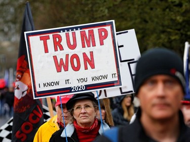 A protester holds a sign saying "Trump Won" at a rally in support of U.S. President Donald Trump at the Oregon State Capitol in Salem, Oregon, U.S. January 6, 2021.  REUTERS/Terray Sylvester ORG XMIT: GGG-SAL118