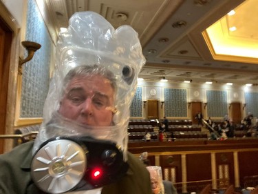 Rep. David Trone wears a gas mask inside the U.S. Capitol in Washington, DC, U.S., January 6, 2021, in this still image obtained from social media. Twitter/@RepDavidTrone/via REUTERS  ATTENTION EDITOR - THIS IMAGE HAS BEEN SUPPLIED BY A THIRD PARTY. MANDATORY CREDIT. NO RESALES. NO ARCHIVES ORG XMIT: GDN