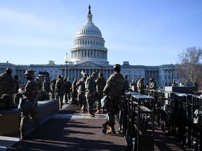 National Guard members deploy on U.S. Capitol grounds, after U.S. President Donald Trump was impeached for a second time, in Washington, U.S., January 14, 2021.