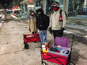 An Ottawa Street Medics patrol on Sparks Street with wagons of food, drinks, hand-warmers and winter clothing for people in need, on Jan. 20.