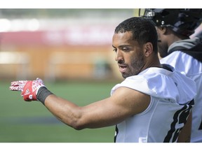 Ottawa RedBlacks player Nate Behar chats with a teammate during practice on May 25, 2019.