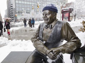 Sometimes people put winter toques on this statue near the National Arts Centre. Who is the statue of? Try our quiz, below.