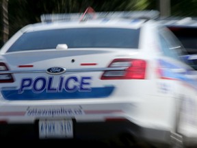 STOCK ART of Ottawa Police at Ambulance vehicles.