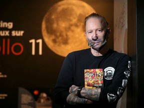 Local novelist Mike Blouin, will have a digital copy of his latest book, Skin House, go to the moon. Photographed Friday at the Apollo 11 exhibit at the Canadian Aviation and Space Museum in Ottawa.