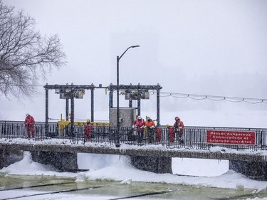 Crews were working with explosive charges and various other equipment to blast and break up ice on the Rideau River, Saturday Feb. 27, 2021. The city undertakes ice breaking operations near the Rideau Falls to alleviate possible spring flooding in flood-prone areas. People came out to watch the process.