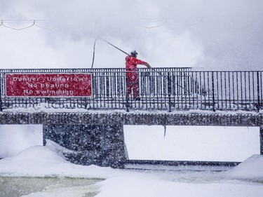 Crews were working with explosive charges and various other equipment to blast and break up ice on the Rideau River, Saturday Feb. 27, 2021. The city undertakes ice breaking operations near the Rideau Falls to alleviate possible spring flooding in flood-prone areas. People came out to watch the process.