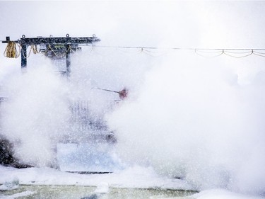 Crews were working with explosive charges and various other equipment to blast and break up ice on the Rideau River, Saturday Feb. 27, 2021. The city undertakes ice breaking operations near the Rideau Falls to alleviate possible spring flooding in flood-prone areas. People came out to watch the process.