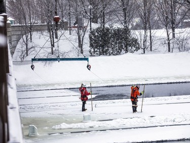 Crews were working with explosive charges and various other equipment to blast and break up ice on the Rideau River, Saturday Feb. 27, 2021. The city undertakes ice breaking operations near the Rideau Falls to alleviate possible spring flooding in flood-prone areas. People came out to watch the process.