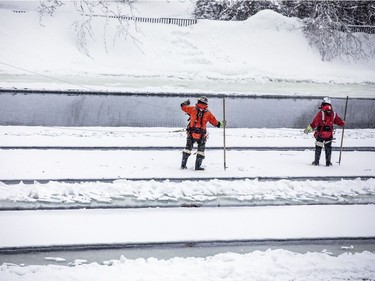 Crews were working with explosive charges and various other equipment to blast and break up ice on the Rideau River, Saturday Feb. 27, 2021. The city undertakes ice breaking operations near the Rideau Falls to alleviate possible spring flooding in flood-prone areas. People came out to watch the process.