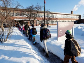 Students return to school after a four-week lockdown at Vincent Massey Public School in Ottawa.