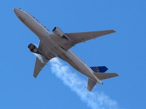 United Airlines flight UA328, carrying 231 passengers and 10 crew on board, returns to Denver International Airport with its starboard engine on fire after it called a Mayday alert, over Denver, Colorado, U.S. February 20, 2021.